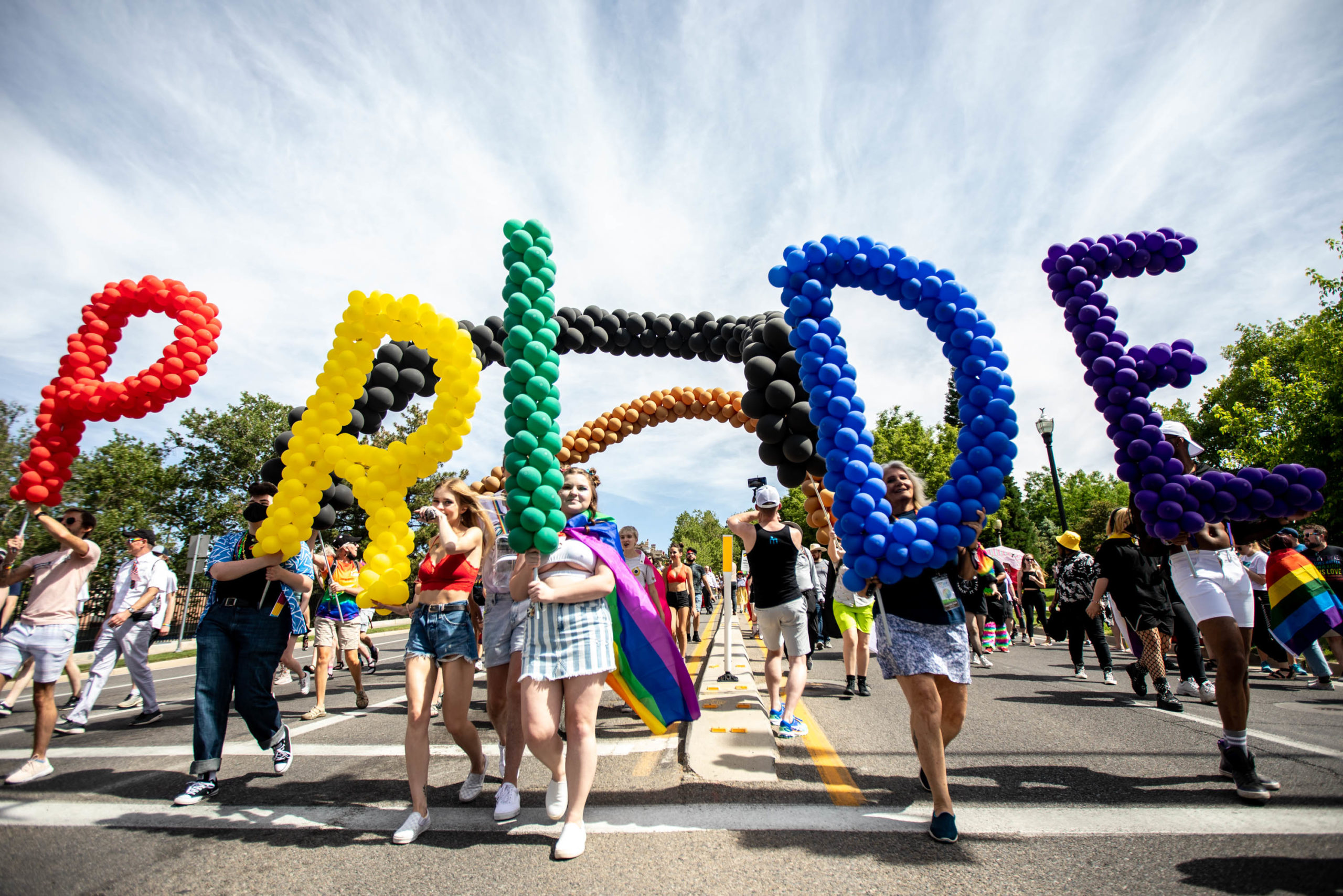 ‘Celebrating the beautiful spectrum of your souls’ Hundreds march for pride in Salt Lake City